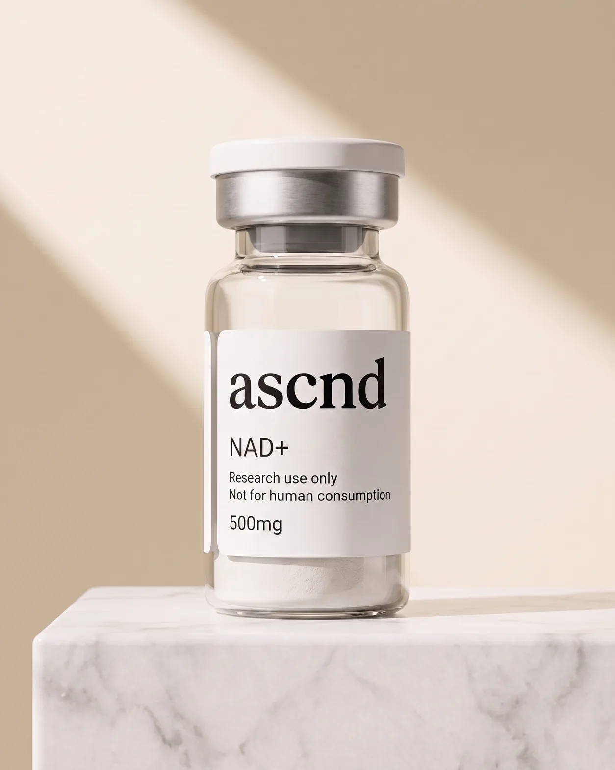 ASCND vial labelled NAD+ 500mg beside its black ascnd carton, on a studio background