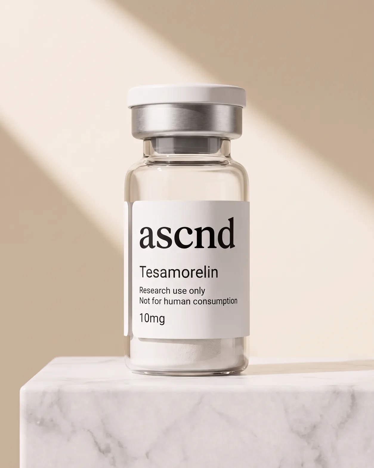 ASCND vial labelled Tesamorelin 10mg beside its black ascnd carton, on a studio background